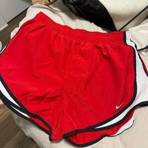 Nike red running shorts